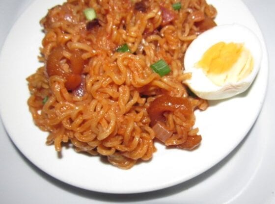 Nigerian jollof noodles with a piece of boiled egg
