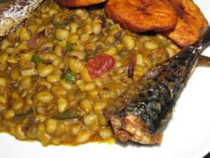 Serving of Nigerian beans porridge with fish 